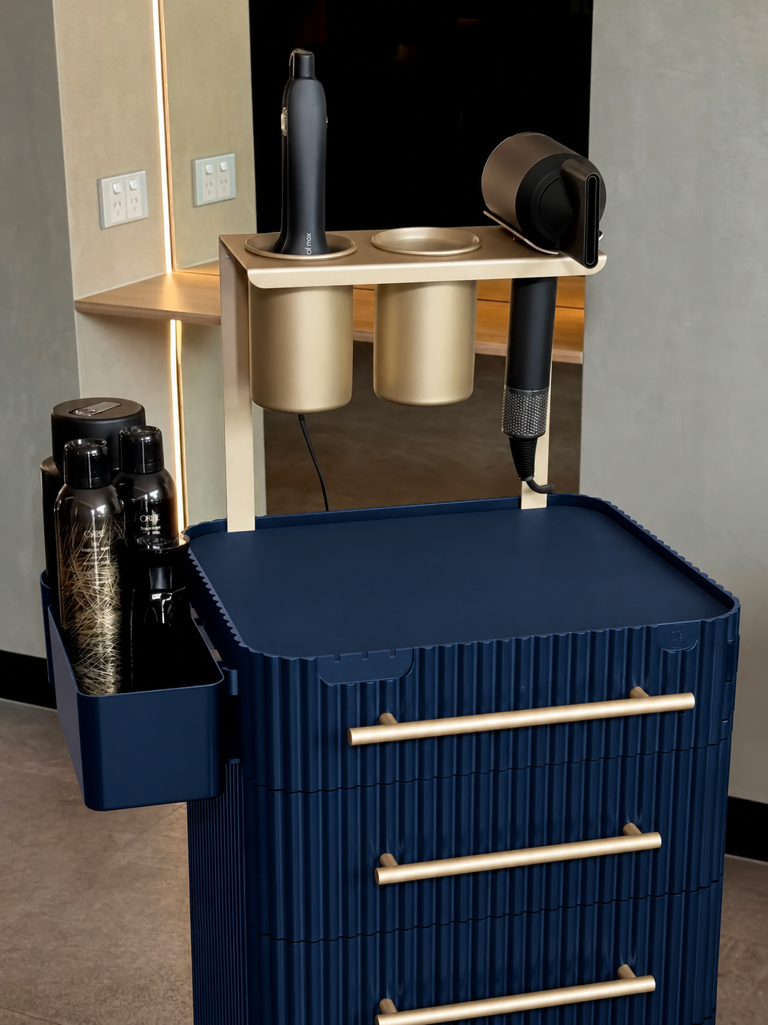 Close-up of the Navy & Gold trolley upper holders and gold-coloured fittings